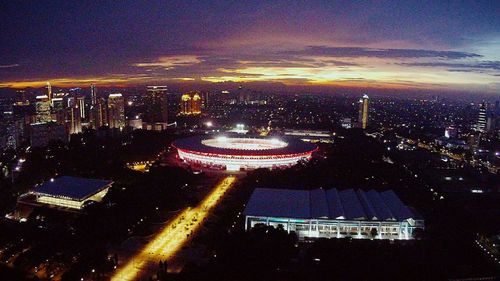 High angle view of illuminated cityscape at night