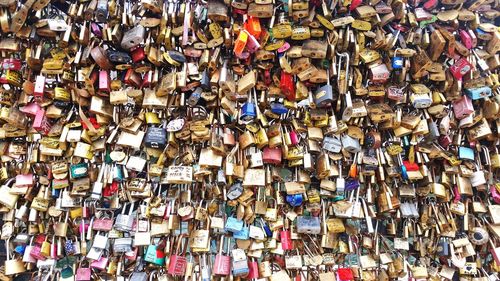 Close-up of padlocks hanging on railing