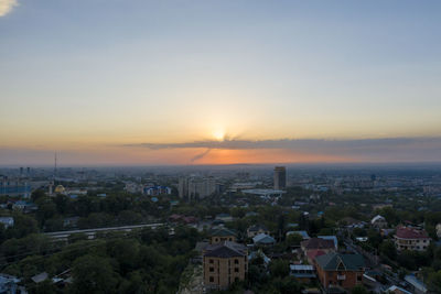 High angle view of townscape against sky during sunset