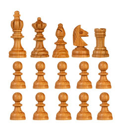 Low angle view of chess board against white background