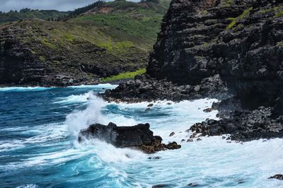 Sea waves splashing on rocks