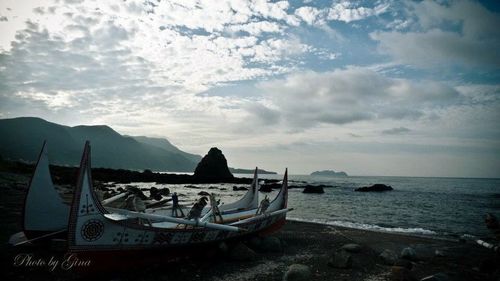 Scenic view of sea against cloudy sky