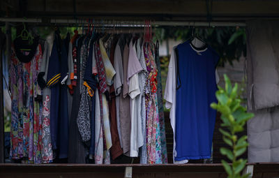 Clothes hanging in rack for sale at market