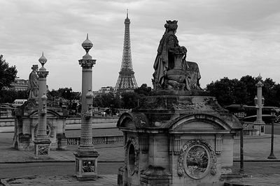 Sculpture of buildings against cloudy sky