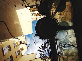 Low angle view of street light against building