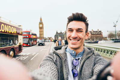 Portrait of smiling man in city