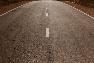 High angle view of arrow symbol on road in city