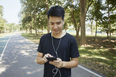 Portrait of teenage girl using mobile phone