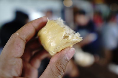 Close-up of hand holding ice cream