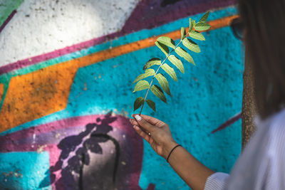 Close-up of hand holding painting