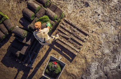 High angle view of man lying down on staircase