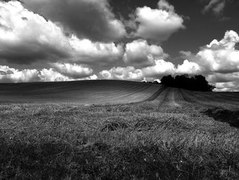 Scenic view of landscape against cloudy sky