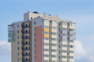 Low angle view of buildings against clear blue sky