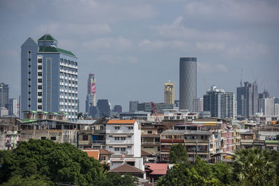 Buildings in city against sky