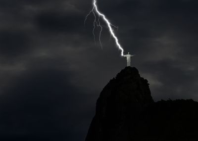 Low angle view of man standing against sky