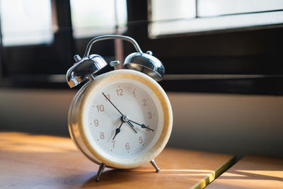 Close-up of clock on table