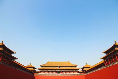 Low angle view of temple against blue sky