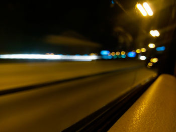 Close-up of illuminated road at night