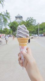 Midsection of woman holding ice cream