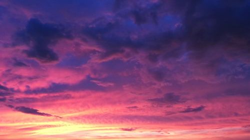 Low angle view of cloudy sky at sunset