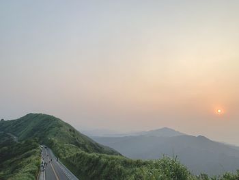 Scenic view of mountains against sky during sunset