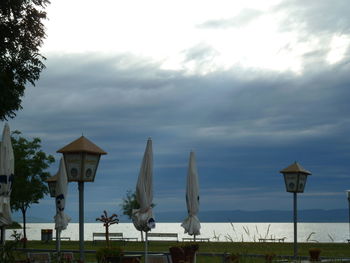 Gazebo by trees against sky