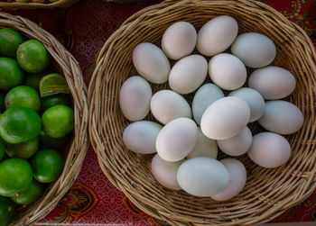 High angle view of fruits in basket on table