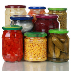 Close-up of various food in glass jar on table