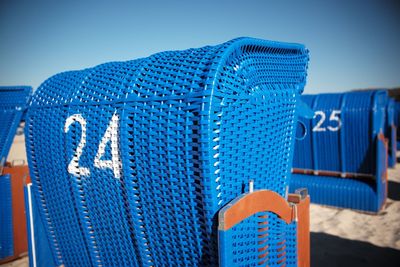 Close-up of blue beach against clear sky