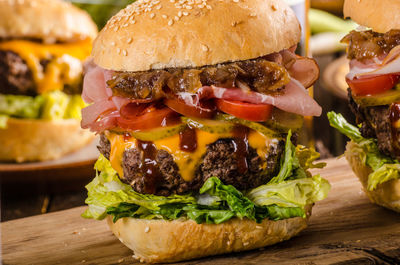 Close-up of burger on serving board at table