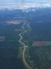 Aerial view of agricultural field against sky