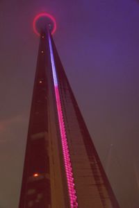 Low angle view of illuminated building at night