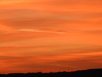Scenic view of dramatic sky during sunset