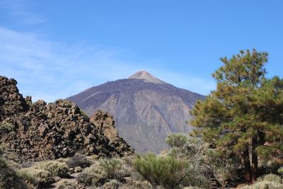 Scenic view of volcanic mountain against sky