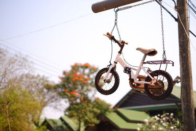 Low angle view of bicycle against clear sky