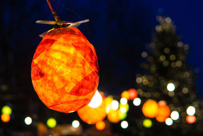 Low angle view of christmas decoration against sky at night