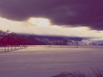 Scenic view of landscape against sky during winter