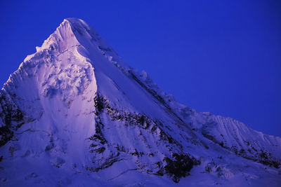 Scenic view of snow covered mountains