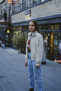 Full length of woman standing in city