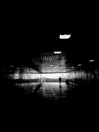 Rear view of silhouette man walking at night