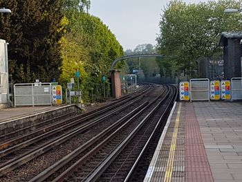 Train at railroad station against sky