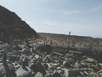 People standing on rocky mountain