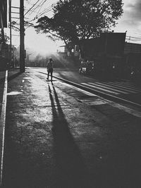 Man walking on street in city