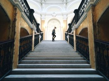 Woman walking on staircase