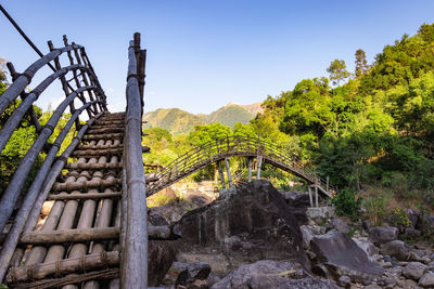 Traditional bamboo bridge for crossing river at forest at morning from different angle