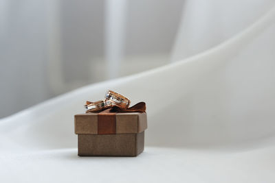 Close-up of wedding rings on box