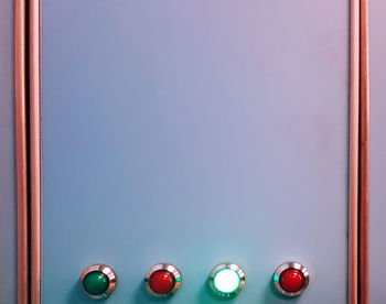 Close-up of multi colored lights on glass door