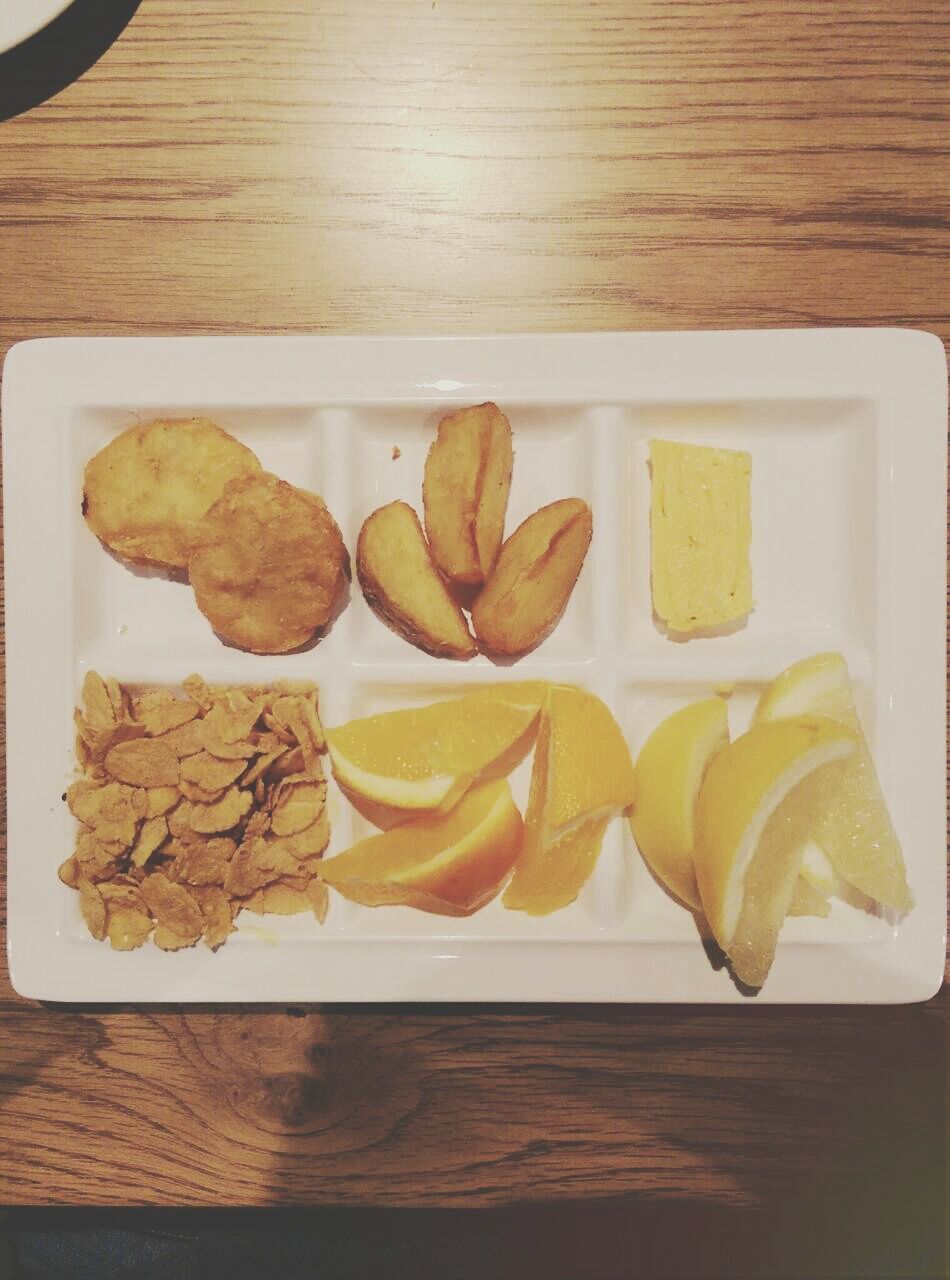 food and drink, indoors, food, freshness, still life, table, healthy eating, high angle view, ready-to-eat, plate, slice, close-up, indulgence, directly above, sweet food, no people, variation, wood - material, cutting board