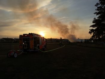 Buildings against sky during sunset in city