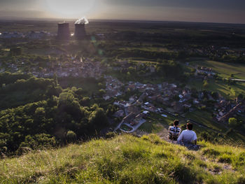 People relaxing on grassy field